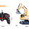 A yellow 1:24 scale remote control excavator model with a black body and tracks.
