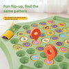 A green flip-up chess game board with removable pieces and a yellow location pin.