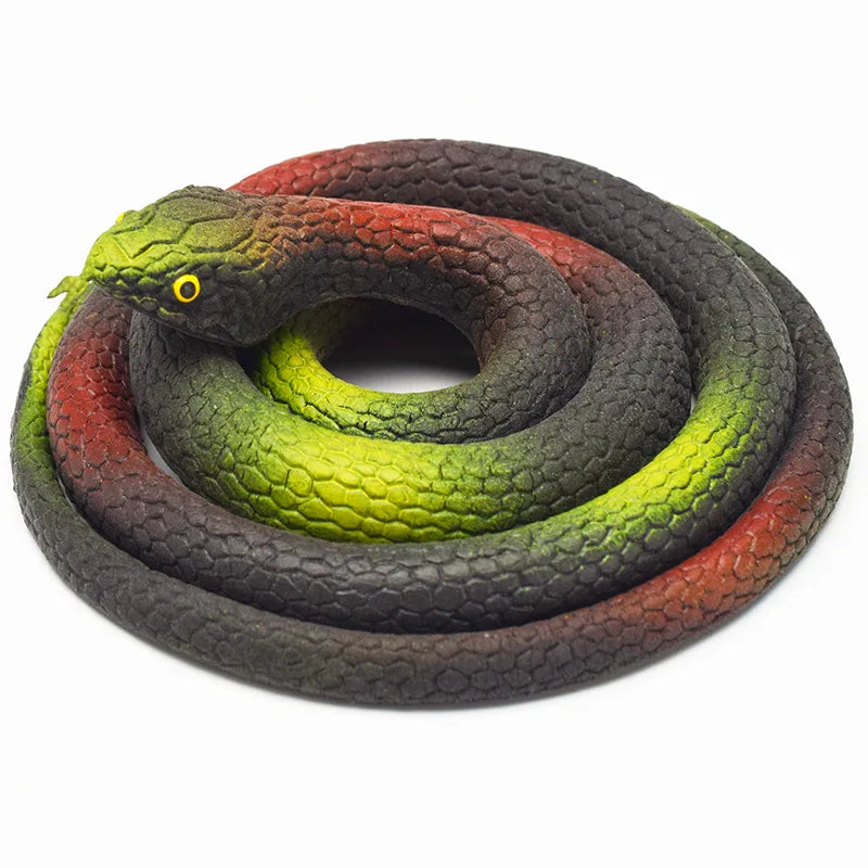 A realistic rubber snake toy with green, yellow, and reddish-brown scales coiled on a white background.