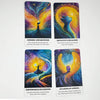 Four tarot-style oracle cards featuring cosmic, healing, empowered, and guardian angel themes