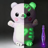 A glowing plush doll resembling a panda, split between purple and green colors.