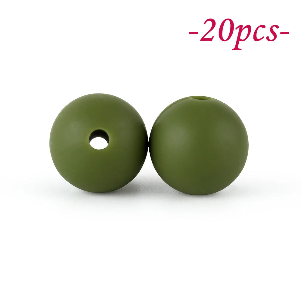 Two round, olive green silicone beads with a hole, shown against a white background.
