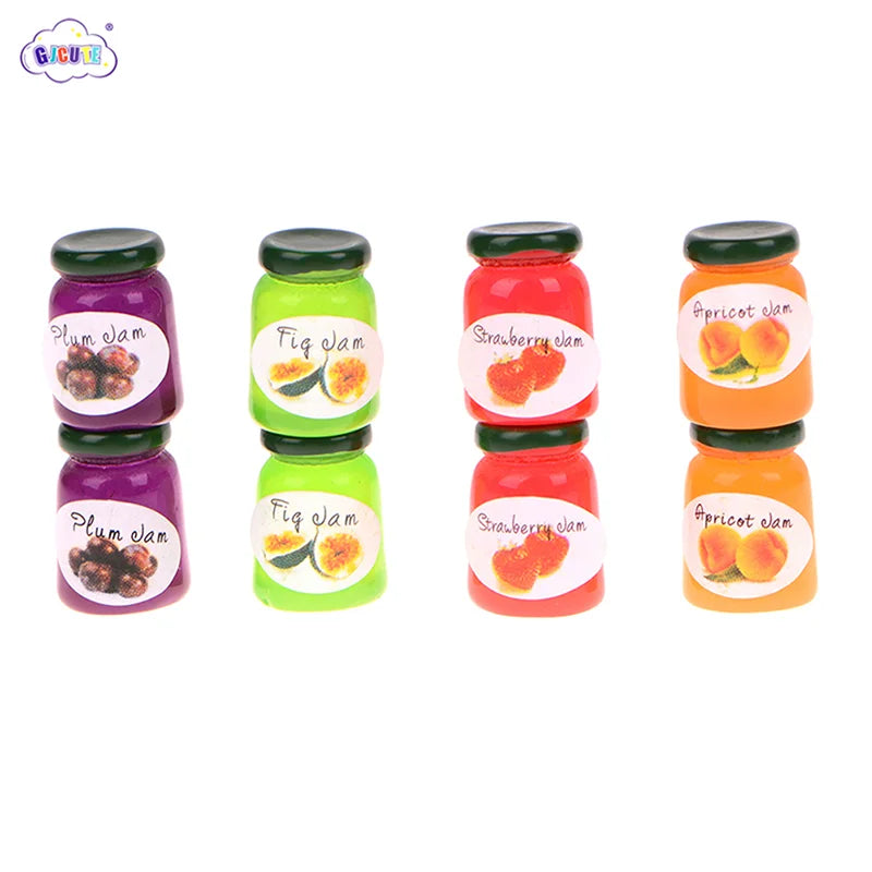 A set of five miniature ceramic jam jars in various fruit flavors including plum, fig, strawberry, and apricot.