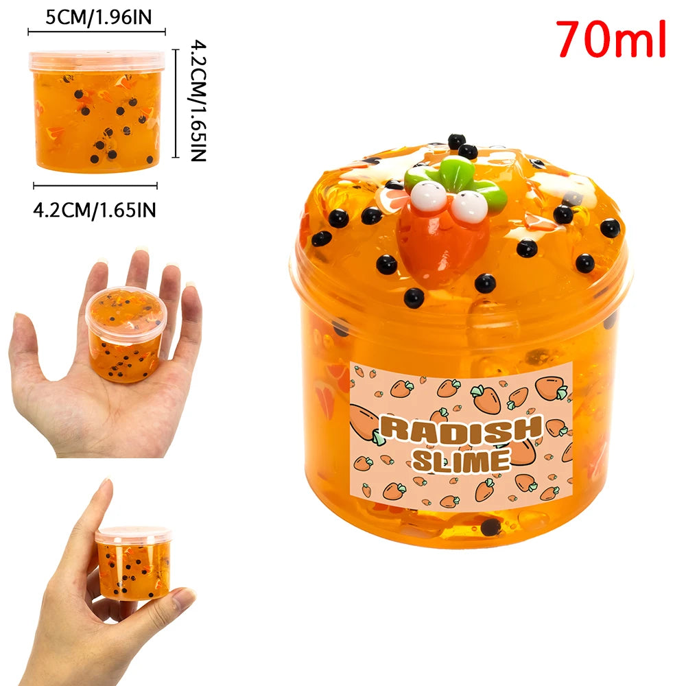 A jar of orange jelly slime with fruit decorations, showing the texture and scent kit.