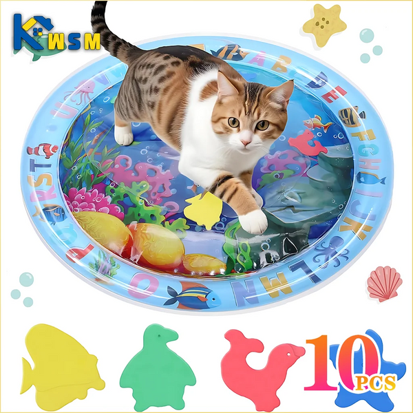 A tabby cat is playing on a blue sensory mat filled with colorful plastic toys and food items.