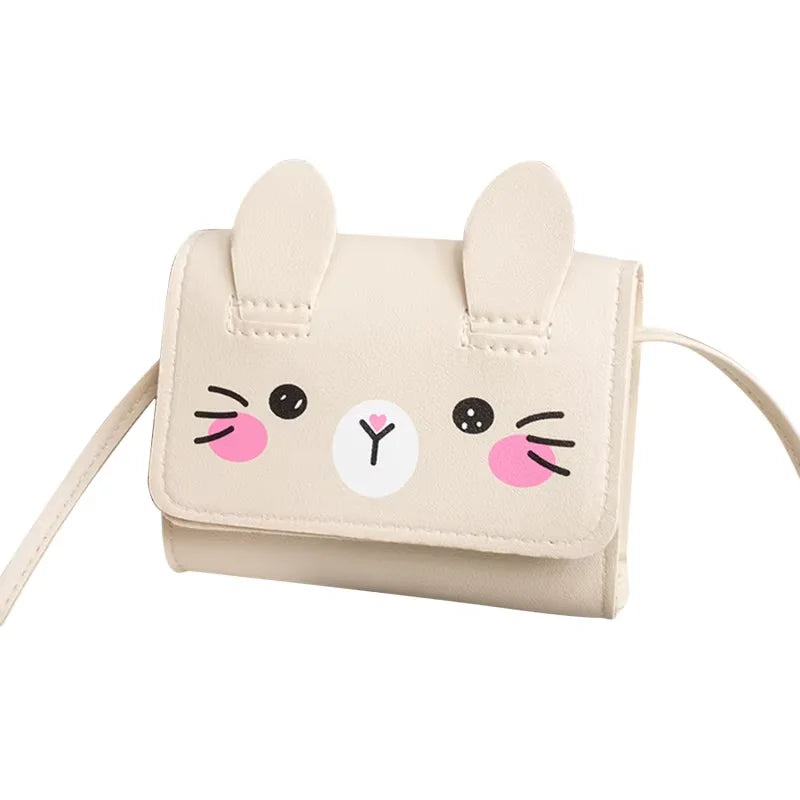 A light beige mini PU leather crossbody handbag shaped like a cute cat face with pink accents.