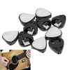 Six black adhesive guitar pick holders with silver covers shown above a wooden guitar neck.