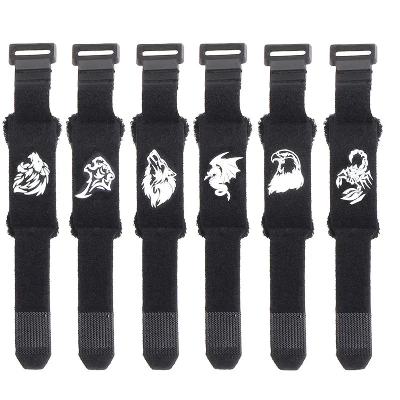 A set of black guitar string dampeners with adjustable tension visible side by side.