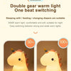 A cute unicorn silicone LED night light showing soft and strong warm light options for sleeping and feeding