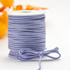 Roll of purple velvet faux suede braided ribbon for crafting and gift wrapping