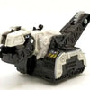 A black and white die-cast dinosaur truck toy with a removable dinosaur figure.