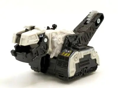 A black and white die-cast dinosaur truck toy with a removable dinosaur figure.