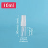 A white refillable travel spray bottle with a fine mist pump is shown against a light blue background.