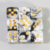 A set of ten 16mm acrylic dice featuring black and white marbled patterns with gold dots.