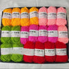 A pack of 20 skeins of various colored yarn in pink, orange, and green for knitting and crochet projects.