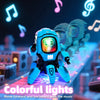 A blue robot toy with colorful lights is shown on a circuit board, moving forward and backward with music.