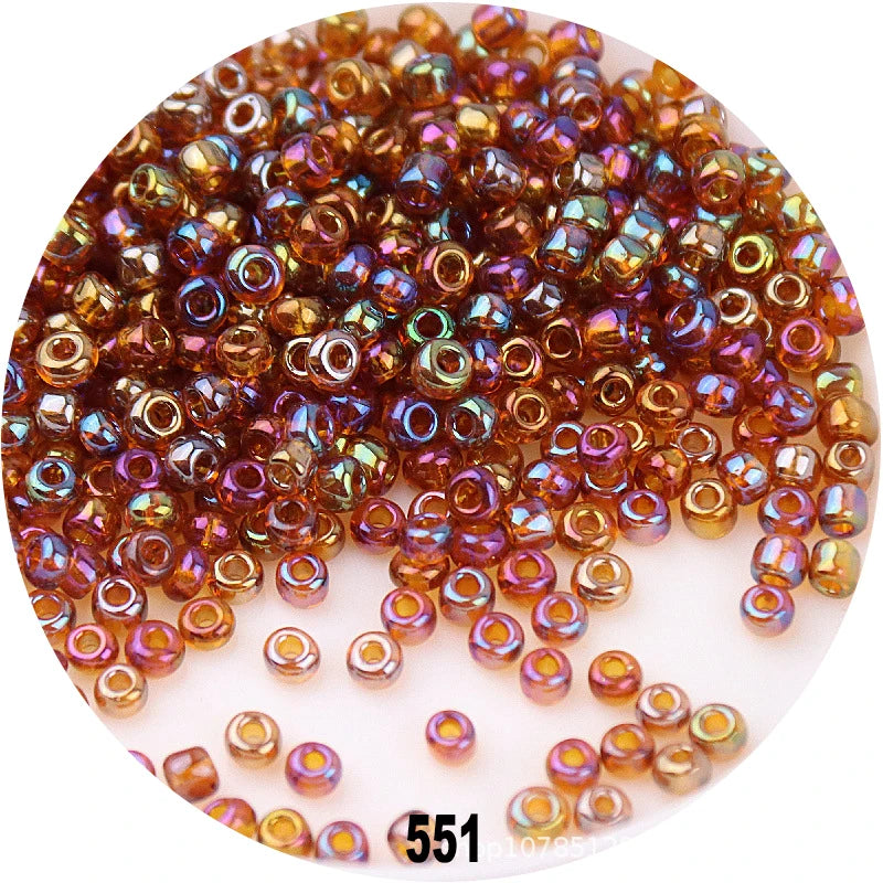A pile of colorful round loose glass seed beads for jewelry making