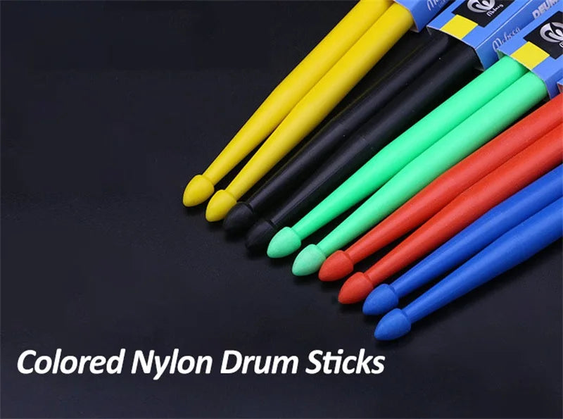 A collection of colored nylon drumsticks in yellow, black, green, red, and blue are displayed against a dark background.