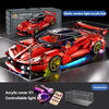 A red Super Car model built from light acrylic blocks, displayed on a glass surface with accessories.