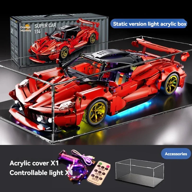 A red Super Car model built from light acrylic blocks, displayed on a glass surface with accessories.