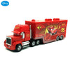 A red die-cast toy hauler truck modeled after Lightning McQueen from Pixar Cars