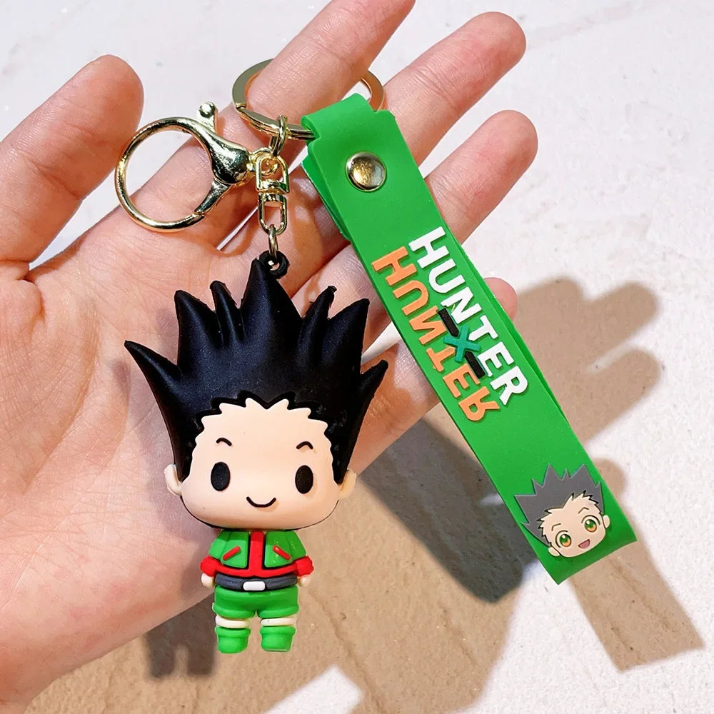 A resin keychain featuring an anime character from Hunter x Hunter, with black spiky hair and a green outfit.
