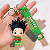 A resin keychain featuring an anime character from Hunter x Hunter with black spiky hair and a green tag.
