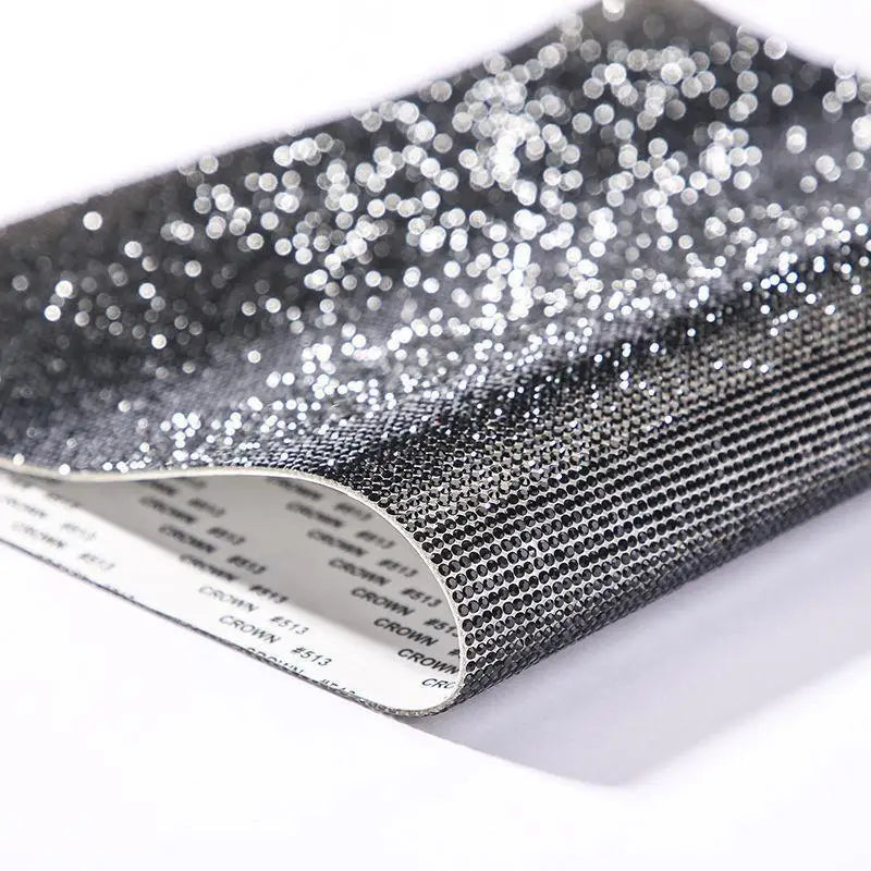 Roll of sparkling silver rhinestone adhesive tape for DIY crafts and decor