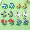 A collection of colorful enamel flower charms featuring blue, yellow, and red roses and blossoms for jewelry making.
