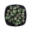 A bowl filled with small, round silicone beads featuring a leopard and daisy print in green and brown.