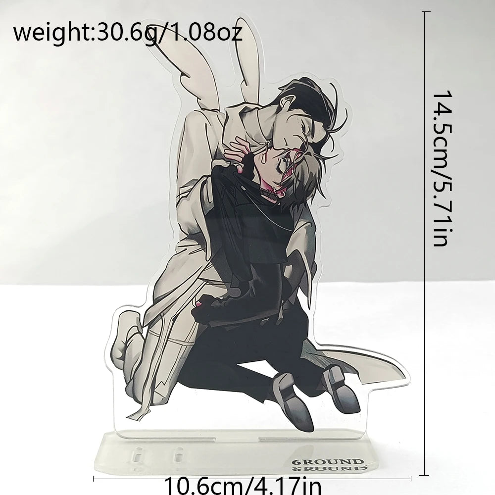 A black and white anime figure of a character in a dynamic pose is displayed on a clear acrylic stand.