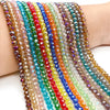 A close-up of multicolored faceted crystal beads strung together on a bracelet or string.