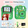 A green instant color printing camera with accessories like thermal paper, a USB data cable, and a 32GB card.