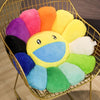 A collection of colorful, round sunflower-shaped plush cushions in various shades of yellow, orange, pink, purple, and blue d