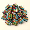 A pile of colorful silicone beads shaped like bingo cards for DIY jewelry and accessories