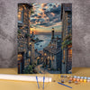 A paint by numbers kit depicting a landscape of a wooden house and flower field under a sunset sky.