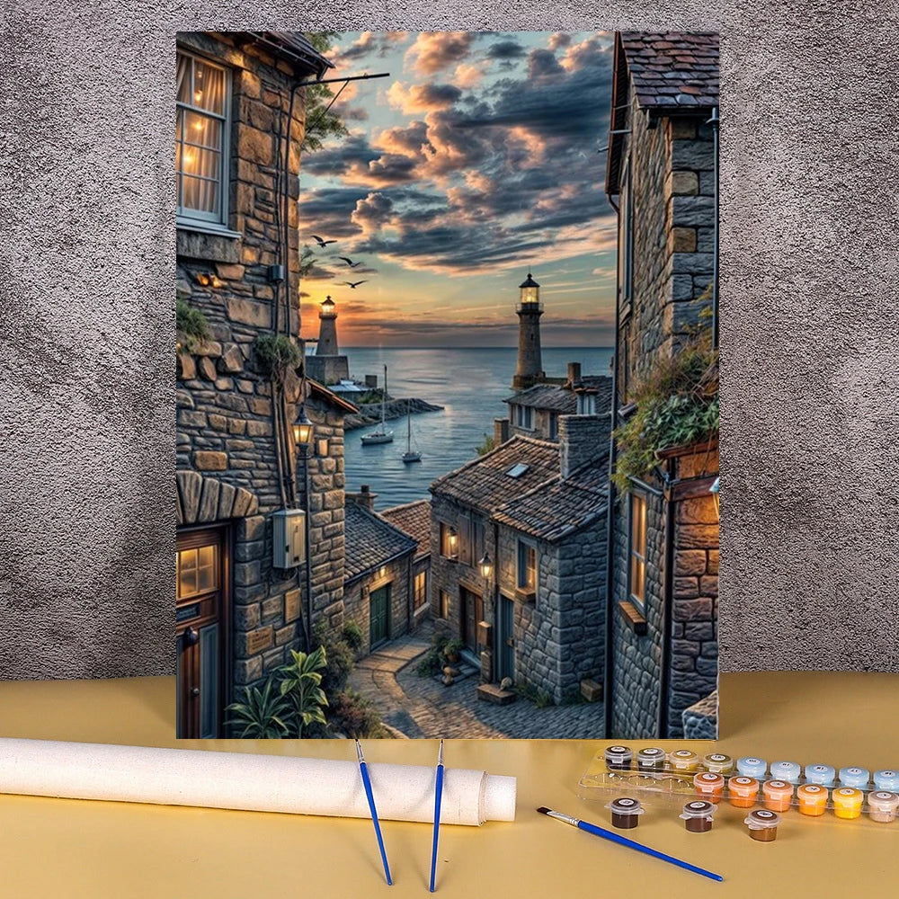 A paint by numbers kit depicting a landscape of a wooden house and flower field under a sunset sky.