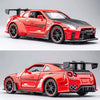 A red Nissan GTR R35 diecast model car with black accents and performance features.