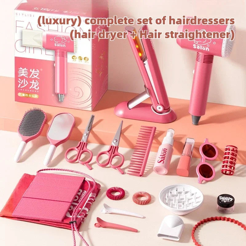 A pink kids hair salon role play set complete with a hairdryer, straightener, scissors, combs, and styling tools.