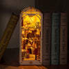 A miniature dollhouse kit featuring a detailed interior scene with warm LED lighting.