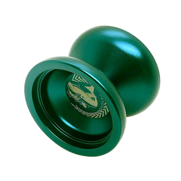 A glossy dark green metal shark yoyo with multiple tricks.