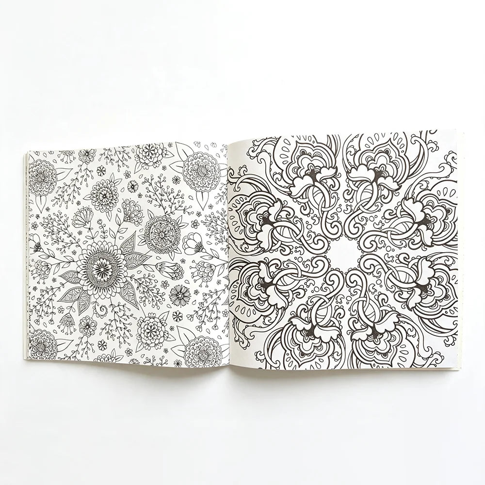 An open 24-page mandala coloring book featuring intricate black and white floral and swirling patterns.