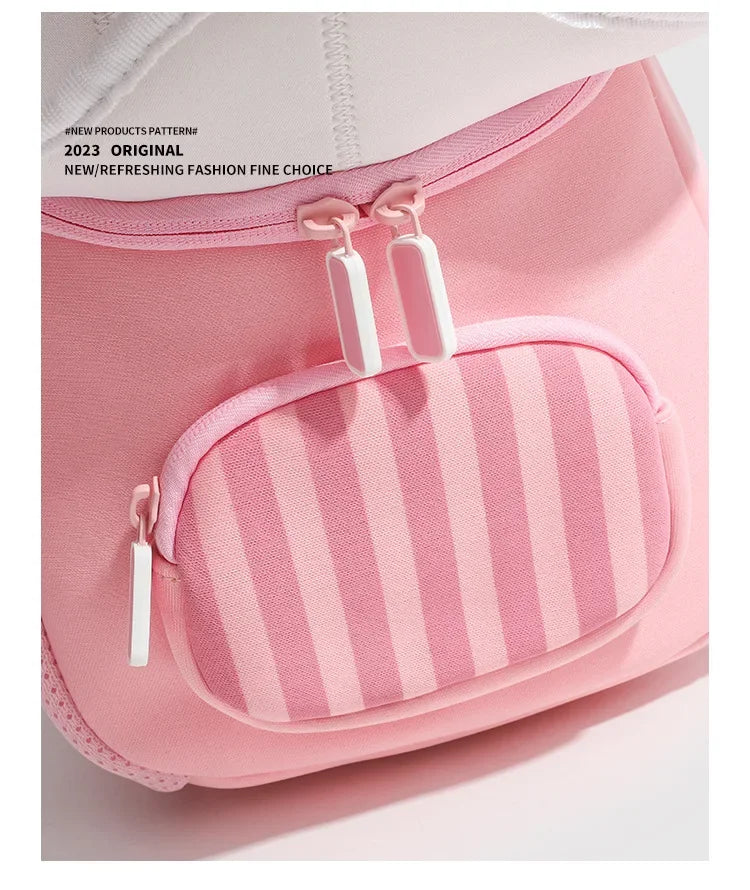 Pink mini backpack with a striped fabric detail and white zipper pulls