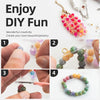 Hands are assembling colorful smooth round glass beads for jewelry making projects.