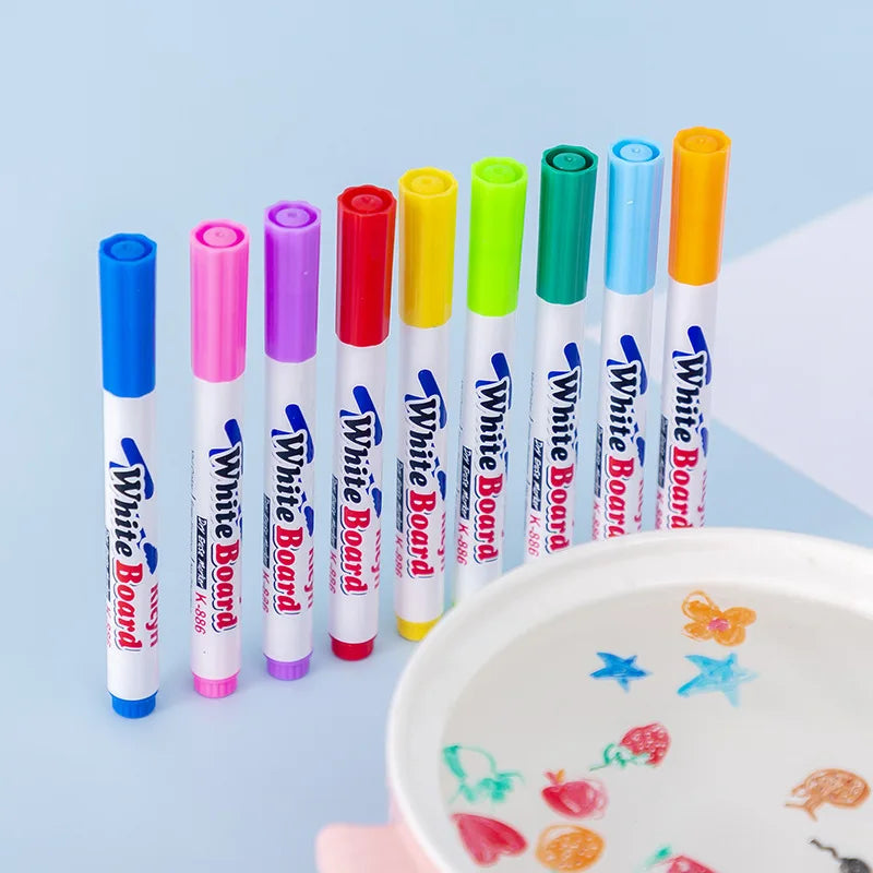 A set of colorful white and pink paintbrushes for an ink art kit