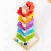 A wooden rainbow ball track toy featuring colorful blocks stacked vertically.