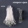 A bundle of white pre-waxed cotton candle wicks with metal sustainers shown next to a single stick.