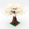 A model of a cherry blossom tree built from light yellow blocks on a brown trunk and green base.