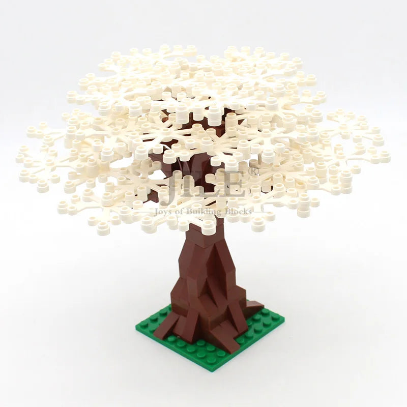 A model of a cherry blossom tree built from light yellow blocks on a brown trunk and green base.