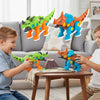 Two children play with orange and blue dinosaur toys that feature an electric drill mechanism.